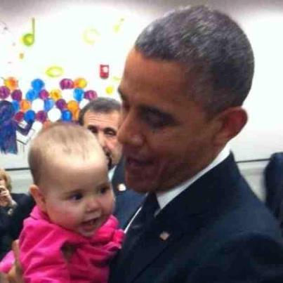 Photo: Powerful imagery. —President Obama visited Newtown for a memorial service for the victims of Sandy Hook Elementary. While he was there he held the granddaughter of Principal Dawn Hochsprung, who lost her life defending the children of her school. Principal Hochsprung's daughter shared this photo on Twitter.