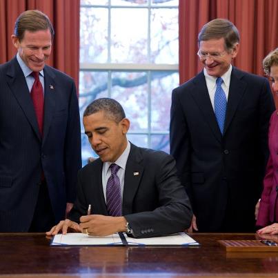 Photo: President Barack Obama signs  H.R. 6063, the Child Protection Act of 2012, in the Oval Office, Dec. 7, 2012. Pictured, from left, are: Sen Richard Blumenthal, D-Conn; Rep. Lamar Smith, R-Texas; Rep. Debbie Wasserman Schultz, D-Fla. (Official White House Photo by Pete Souza)