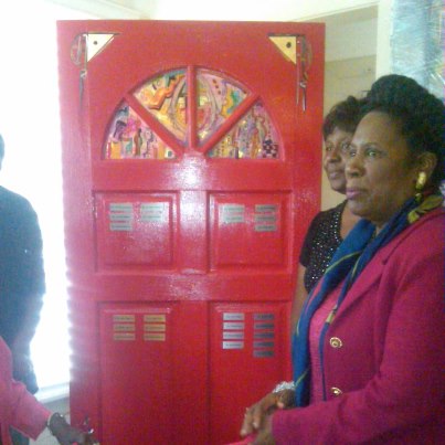 Photo: Unveils the Red Door of the Elneta McClain Women's Center in 3rd Ward during their official opening. The door was provided by artist Charles Washington