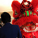 Rep. Judy Chu confronts a dragon dancer at the grand opening of Anca Realty in Temple City (January 11, 2010).