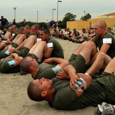 Photo: Recruits at Marine Corps Recruit Depot San Diego perform crunches as part of the Physical Fitness Test (PFT). 

Click here to learn more about preparing for Recruit Training: http://bit.ly/U6XgOH 

Photo property of United States Marine Corps Division of Public Affairs