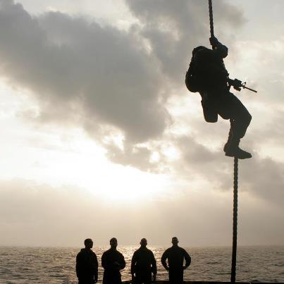 Photo: False: Fast roping is a technique that differs from rappelling because the Marine is not attached to the rope and uses only hands and feet to control the descent. 

Photo property of Division of Public Affairs