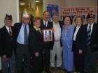Congressman Eliot Engel (center) shows his award from the Rockland County Jewish War Veterans which reads, 