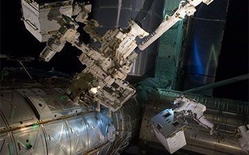 On July 12, 2011, spacewalking astronauts Mike Fossum and Ron Garan transferred the Robotic Refueling Mission module to a temporary platform on the International Space Station’s Dextre robot. Photo Credit: NASA