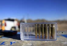 Bullets for a rifle rest on a table along a mountain range in Buckeye, Arizona January 20, 2013. REUTERS/Joshua Lott