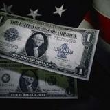 dollar bills on an American flag