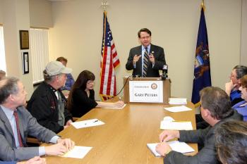 Representative Peters speaking with local residents about creating jobs and cutting taxes