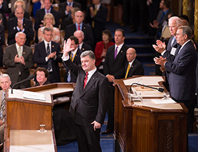 Ukrainian President Poroshenko at the end of his speech to the joint meeting of Congress. Speaker Boehner and Vice President Biden are behind him.