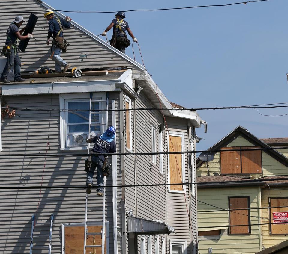 Repairs were underway on Wednesday to a house on Taft Street in Revere, but other residents were still negotiating with insurance companies following last month’s tornado.
