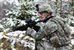 A U.S. soldier awaits instructions before moving out during a squad fire exercise at Hohenfels Training Area, Germany, Dec. 3, 2014. U.S. Army photo by Sgt. William Tanner