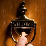 welcome sign on an office doorknocker