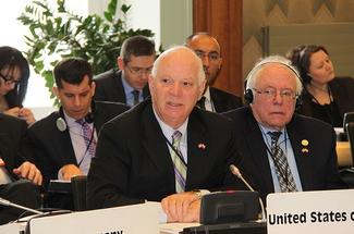 Chairman Cardin, with Senator Sanders, addresses the Assembly.