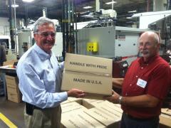 Nolan holds up a box proudly marked &quot;Made In U.S.A.&quot;