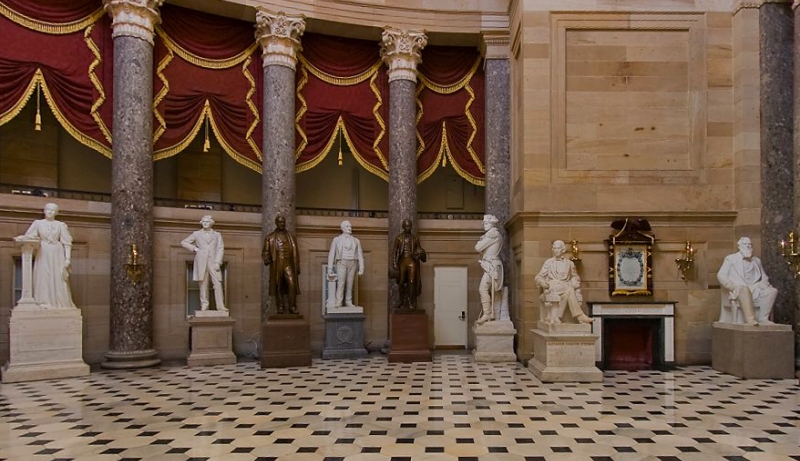 A row of marble statues in National Statuary Hall in the U.S. Capitol.