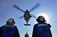 U.S. sailors observe as a helicopter lowers a pallet of supplies across a flight deck during a vertical replenishment aboard guided-missile destroyer USS Gridley in the 5th Fleet area of responsibility, Dec. 1, 2014.U.S. Navy photo by Petty Officer 3rd Class Bryan Jackson
