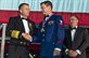 Navy Adm. James A. Winnefeld Jr., vice chairman of the Joint Chiefs of Staff, congratulates Coast Guard Petty Officer 2nd Class Michael Allen during the USO’s 53rd Armed Forces Gala and Gold Medal Dinner in New York, Dec. 4, 2014. Allen, an avionics electrical technician, was one of five service members to receive a USO Military leadership award.DoD photo by U.S. Air Force Master Sgt. Nathan Gallahan