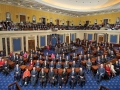 Senators sitting in two story Senate Chamber.