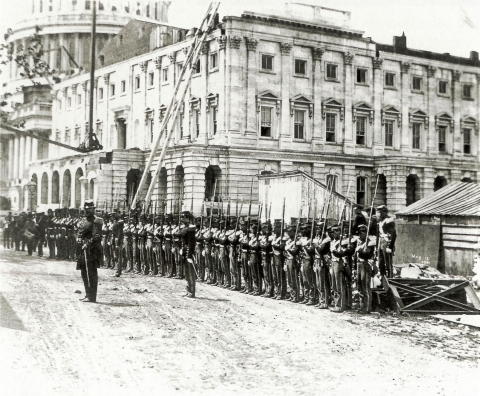 Black and white photograph of Union Troops lined up in front of the Capitol in 1861