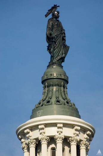 The bronze Statue of Freedom by Thomas Crawford is the crowning feature of the Dome of the United States Capitol.