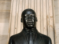 The Martin Luther King, Jr. Bust is a bronze sculpture that is 36 inches high on a 66-inch high Belgian black marble base.