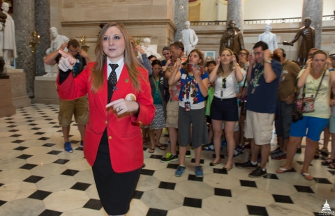 CVC Visitor Guide Julie Butler leads a group of visitors through National Statuary Hall.