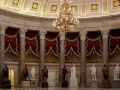 National Statuary Hall in the U.S. Capitol lined with marble statues and columns