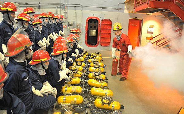 Recruits from division 001 receive safety instructions on proper handling procedures for a CO2 canister Nov. 2 during fire-fighting applications at Recruit Training Command. Fire-fighting training is conducted during week six of eight weeks of boot campt training with applications being the benchmark class.  About 38,000 recruits graduate annually from the Navy's only boot camp.   U.S. Navy photo by Chief Petty Officer Seth Schaeffer (Released)  161102-N-SL853-053