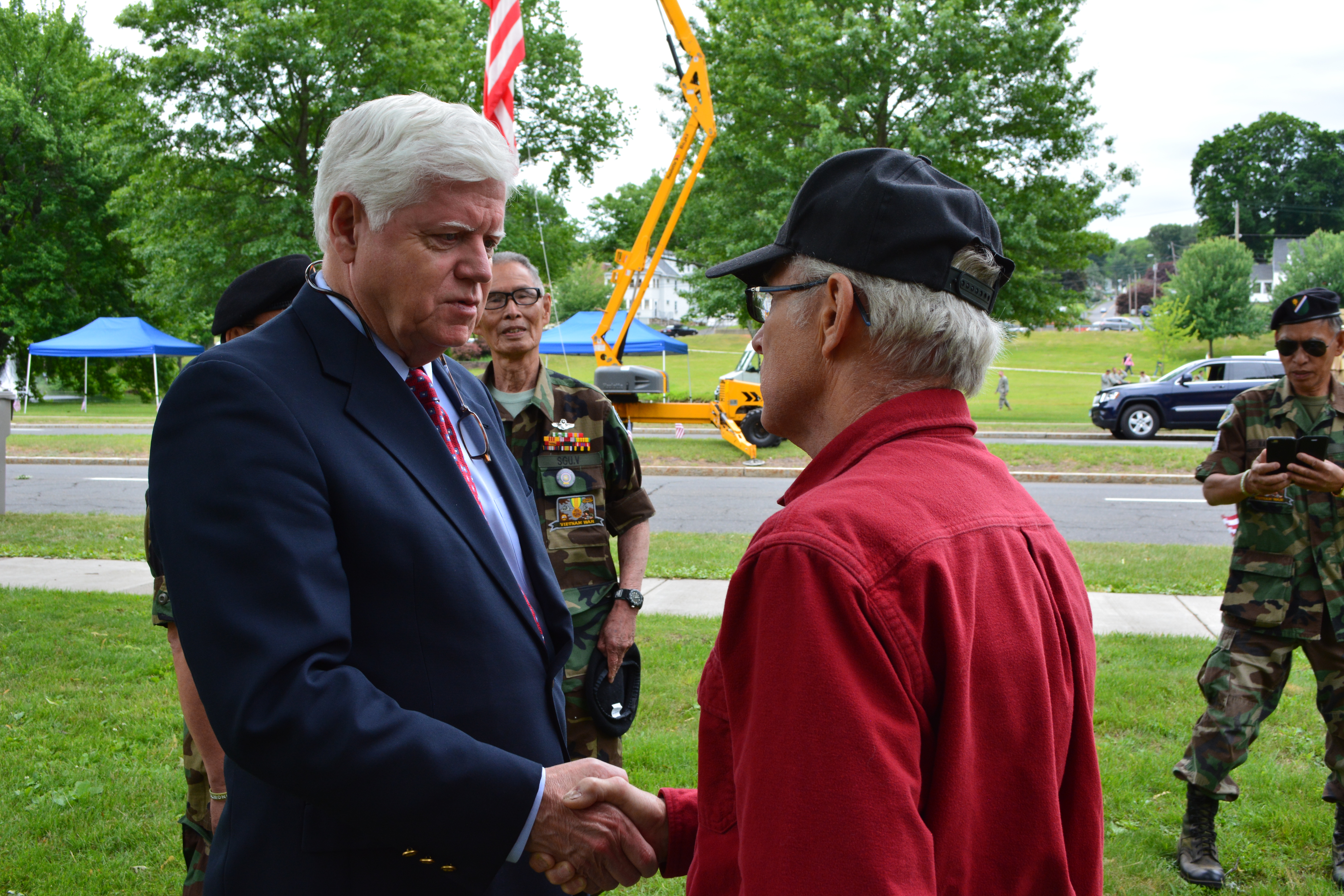 Rep. Larson shakes hands with a veteran in Bristol