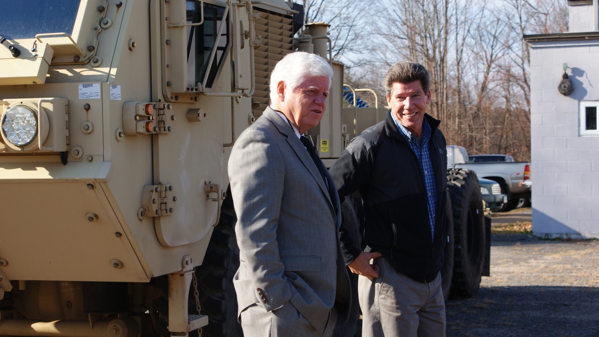 Rep. Larson speaks with President Marty Marola at Tru-Hitch, Inc.