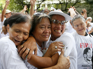 Supporters of late Philippine dictator Ferdinand Marcos shortly after the Philippine Supreme Court voted that Marcos can be buried at the country's Heroes' Cemetery.