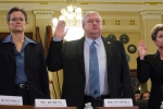 Left to right, Diana Rubens of the VA Philadelphia and Wilmington regional offices, Danny Pummill, principal deputy under secretary for benefits of the Veterans Benefits Administration, and Kimberly Graves of the VA's St. Paul regional office are sworn in at the start of a House Veterans Affairs Committee hearing on alleged misuse of the VA relocation program, Nov. 2, 2015, on Capitol Hill.<br>Joe Gromelski/Stars and Stripes