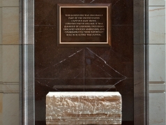 Slave Labor Commemorative Marker in Emancipation Hall at the U.S. Capitol Visitor Center that includes a plaque and piece of stone.
