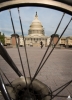 Capitol view through bicycle spokes.