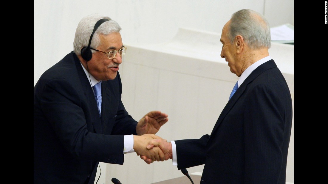 Palestinian Authority President Mahmoud Abbas, left, congratulates President Shimon Peres of Israel after Peres addressed Turkey&#39;s Parliament in Ankara on November 13, 2007, becoming the first Israeli President to speak to a Muslim country&#39;s legislature. 