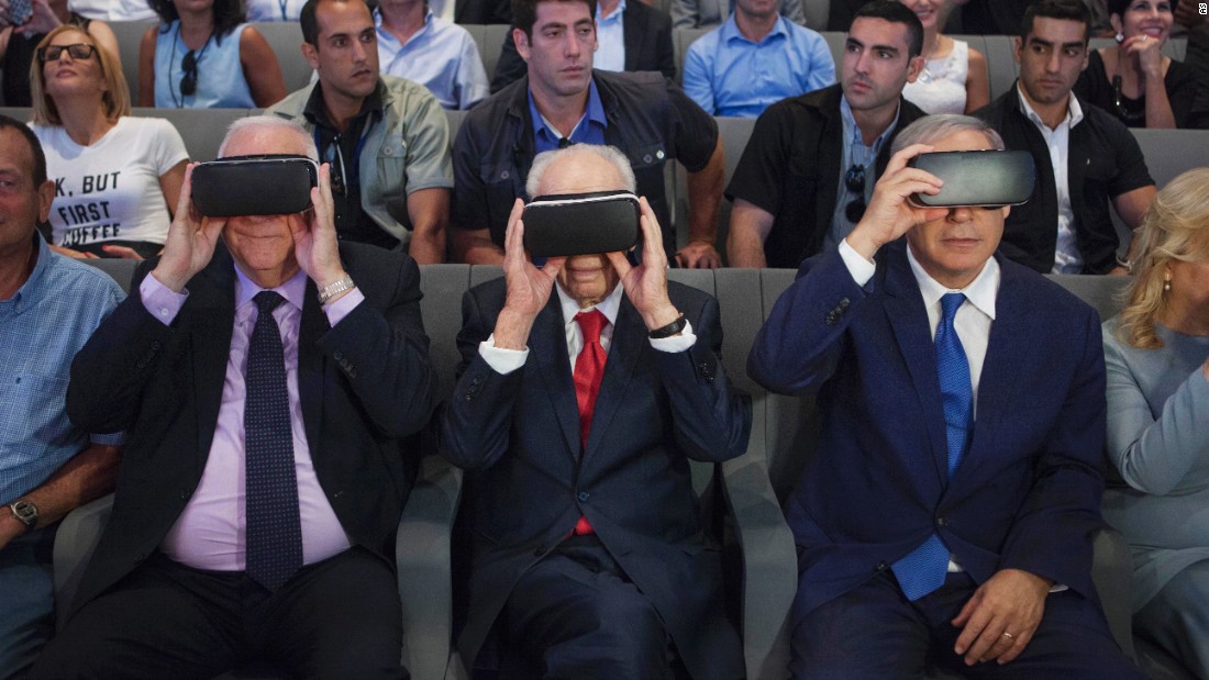 Israeli President Reuven Rivlin, left, former Israeli President Shimon Peres, center, and Israeli Prime Minister Benjamin Netanyahu wear virtual-reality goggles during a presentation at the Peres Center for Peace in Jaffa on July 21, 2016. 