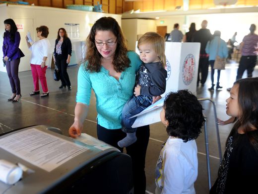 Maria Peralta, of Ventura, votes early in the morning