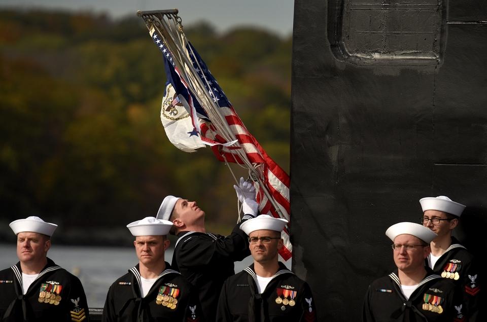 The Flag of the chief of naval operations is raised aboard the newest Virginia-class, fast attack submarine USS Illinois (SSN 786) during the Illinois's commissioning ceremony held on the waterfront at the U.S. Naval Submarine Base in Groton on Saturday, Oct. 29, 2016.   (Tim Cook/The Day)