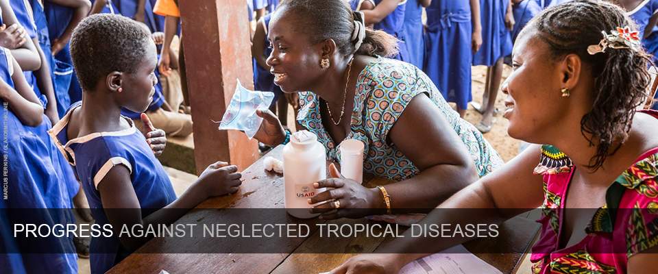 Progress against neglected tropical diseases - A woman educates a child about neglected tropical diseases