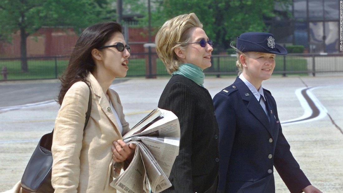 Abedin walks with Clinton at Andrews Air Force Base in 2000 as the Clintons prepared to leave for a wedding in Arkansas.