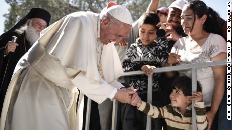 MYTILENE, GREECE - APRIL 16:  In this handout image provided by Greek Prime Minister&#39;s Office, Pope Francis meets migrants at the Moria detention centre on April 16, 2016 in Mytilene, Lesbos, Greece. Pope Francis will visit migrants at the Moria camp on the Greek island of Lesbos along with Greek Orthodox Ecumenical Patriarch Bartholomew I and Archbishop of Athens and All Greece, Ieronimos II. 