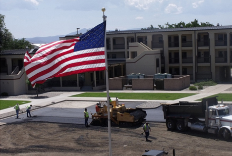 Kirtland Air Force Base, N.M. — Workers lay new pavement to repair a parking lot.