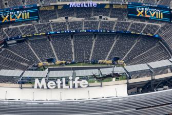 A CBP Black Hawk helicopter flies over MetLive stadium prior to the Super Bowl.