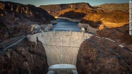 This April 13, 2014 view shows Hoover Dam, a concrete arch-gravity dam in the Black Canyon of the Colorado River on the border between the US states of Arizona and Nevada. Hoover Dam ,finished in 1936, impounds Lake Mead, the largest reservoir in the United States by volume. The dam&#39;s generators provide power for public and private utilities in Nevada, Arizona, and California. Hoover Dam is a major tourist attraction; nearly a million people tour the dam each year. AFP PHOTO/JOE KLAMAR        (Photo credit should read JOE KLAMAR/AFP/Getty Images)