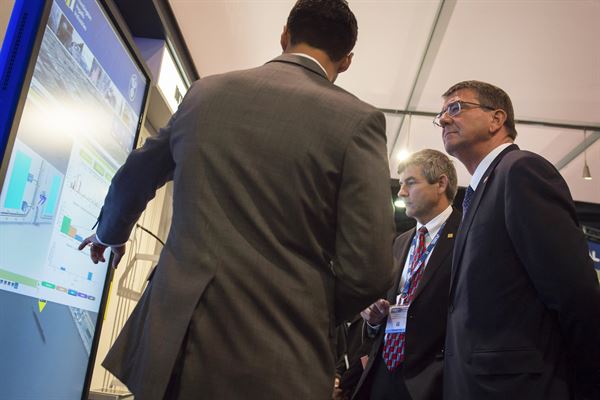 Defense Secretary Ash Carter speaking with an exhibitor.