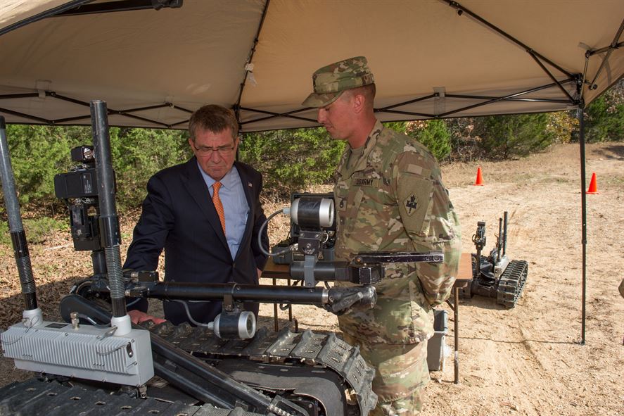 Defense Secretary Ash Carter receives a briefing on route clearance and robot operations.