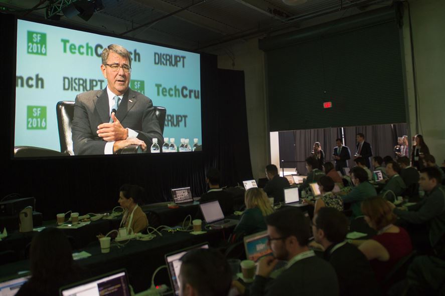 Event attendees watch Defense Secretary Ash Carter speak during the TechCrunch Disrupt innovation and technology conference.