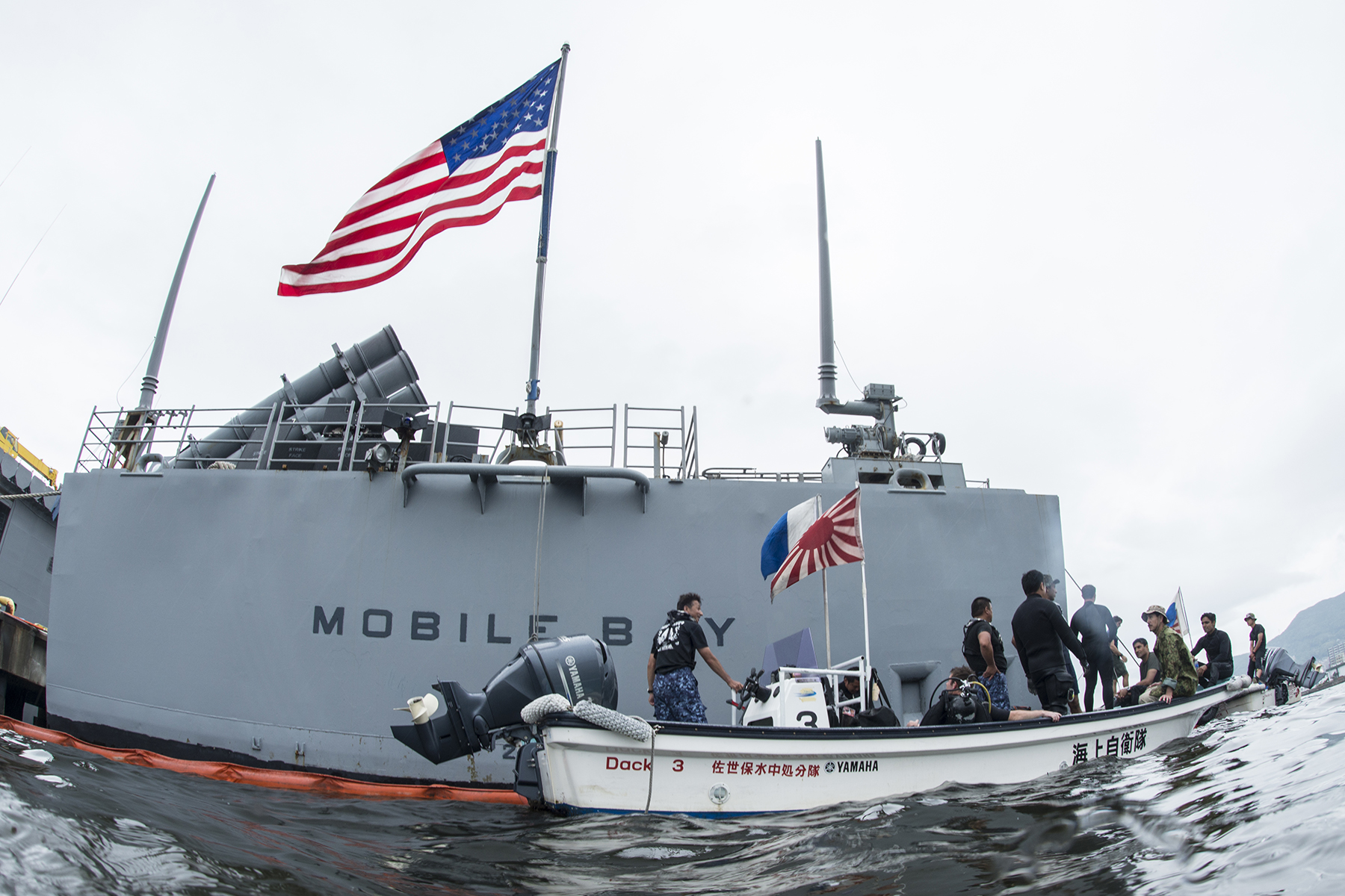 Explosive ordnance disposal technicians from the Indian Navy, Japan Maritime Self-Defense Force and U.S. Navy on a small boat