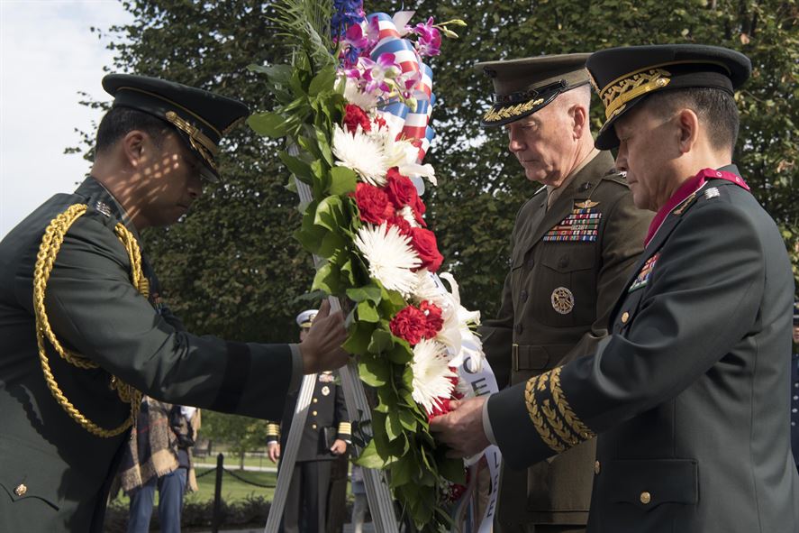 Marine Corps Gen. Joe Dunford, chairman of the Joint Chiefs of Staff, and his counterpart, South Korean Chairman Gen. Sun Jin Lee place a wreath at the Korean War Veterans Memorial.