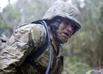 Navy Petty Officer 2nd Class Oscar C. Delarosa gasps for air after crawling through muddy trenches during a 3.8-mile obstacle course at the Jungle Warfare Training Center in Okinawa, Japan, Jan. 12, 2016. Delarosa is assigned to Naval Mobile Construction Battalion 3. Navy photo by Petty Officer 1st Class Michael Gomez