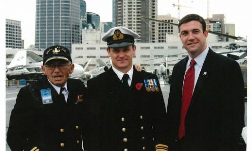 Congressman Hunter stands with fellow veterans after a ceremony aboard the U.S.S. Midway in San Diego feature image